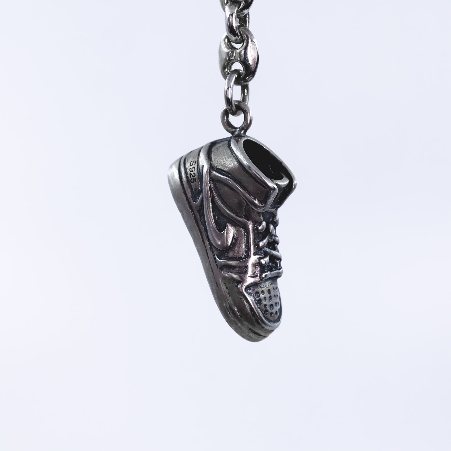 Sole Reflections: Silver solid Vintage shoe keychain.